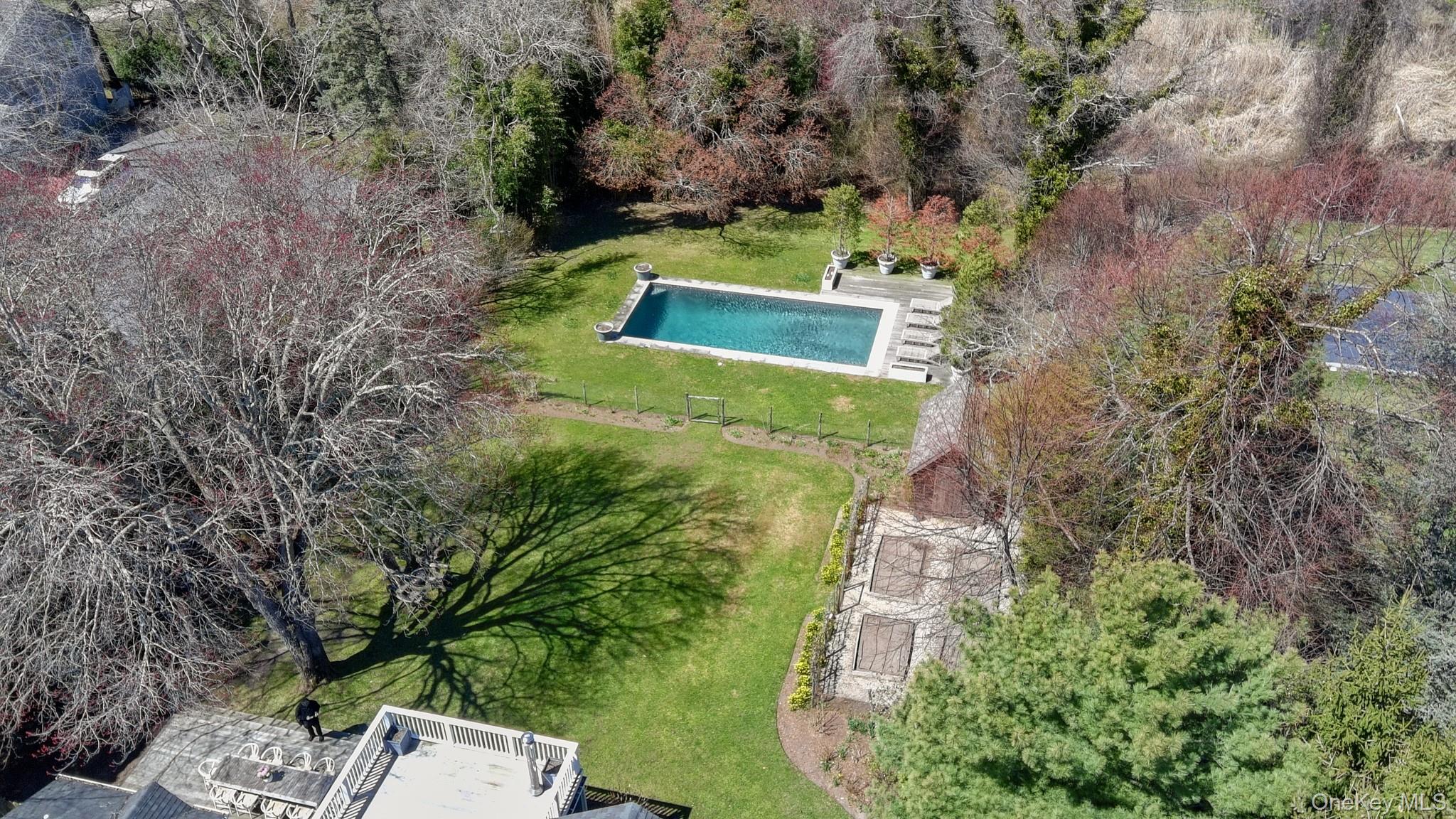 36 South Howells Point Road Bellport, NY 11713 - Photo 20 of 29 a view of a yard with a large tree