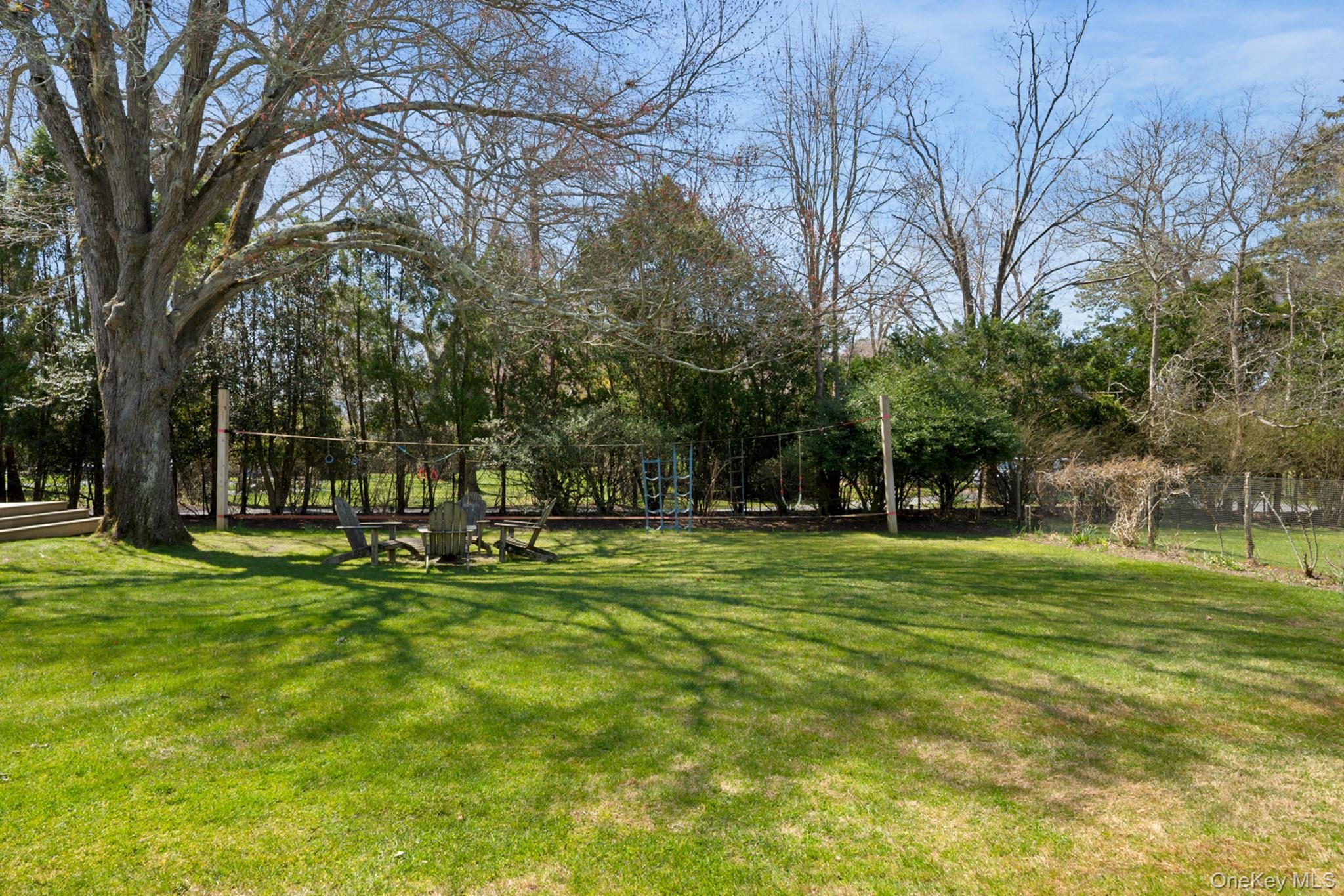 36 South Howells Point Road Bellport, NY 11713 - Photo 22 of 29 a view of a park with large trees