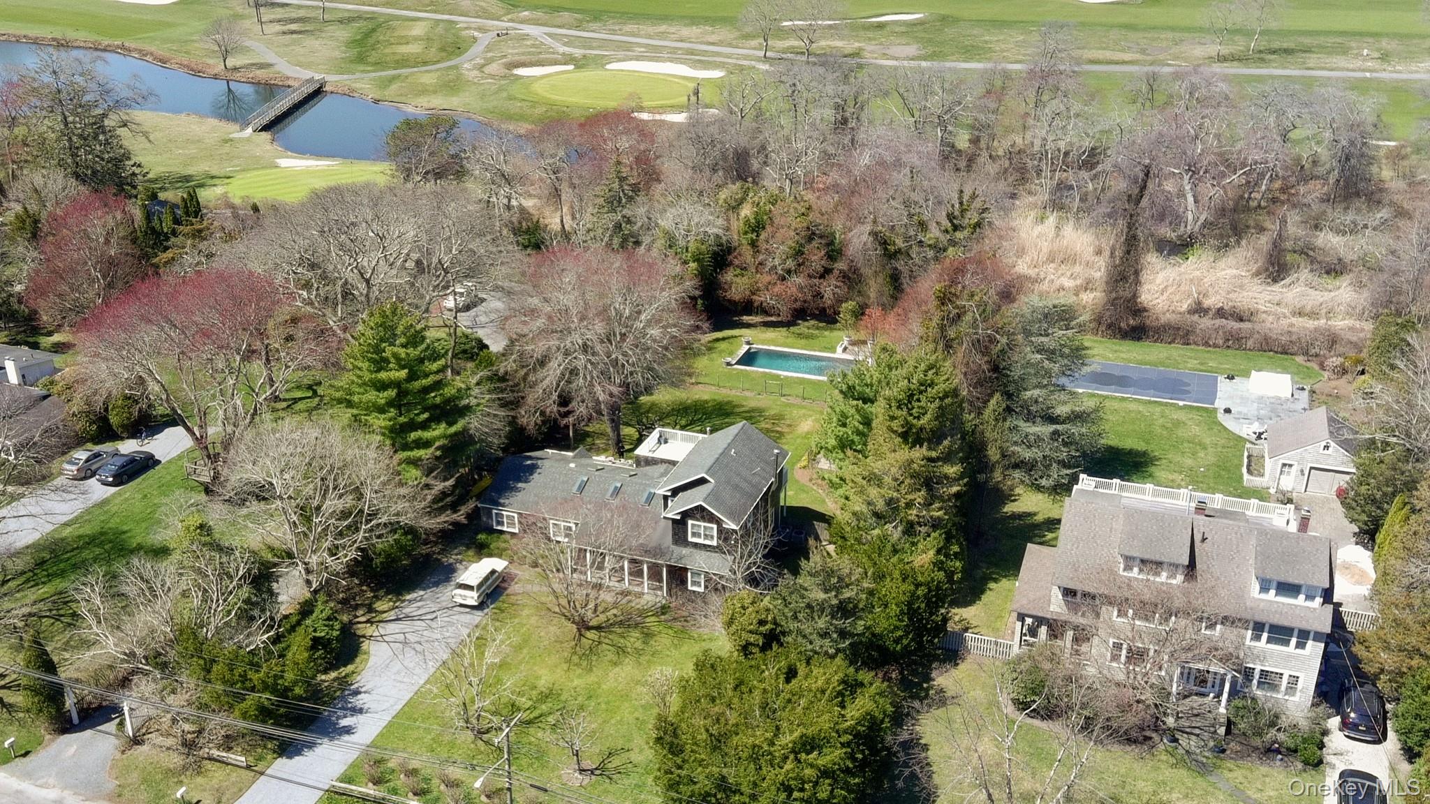 36 South Howells Point Road Bellport, NY 11713 - Photo 23 of 29 an aerial view of a house with a yard basket ball court and outdoor seating
