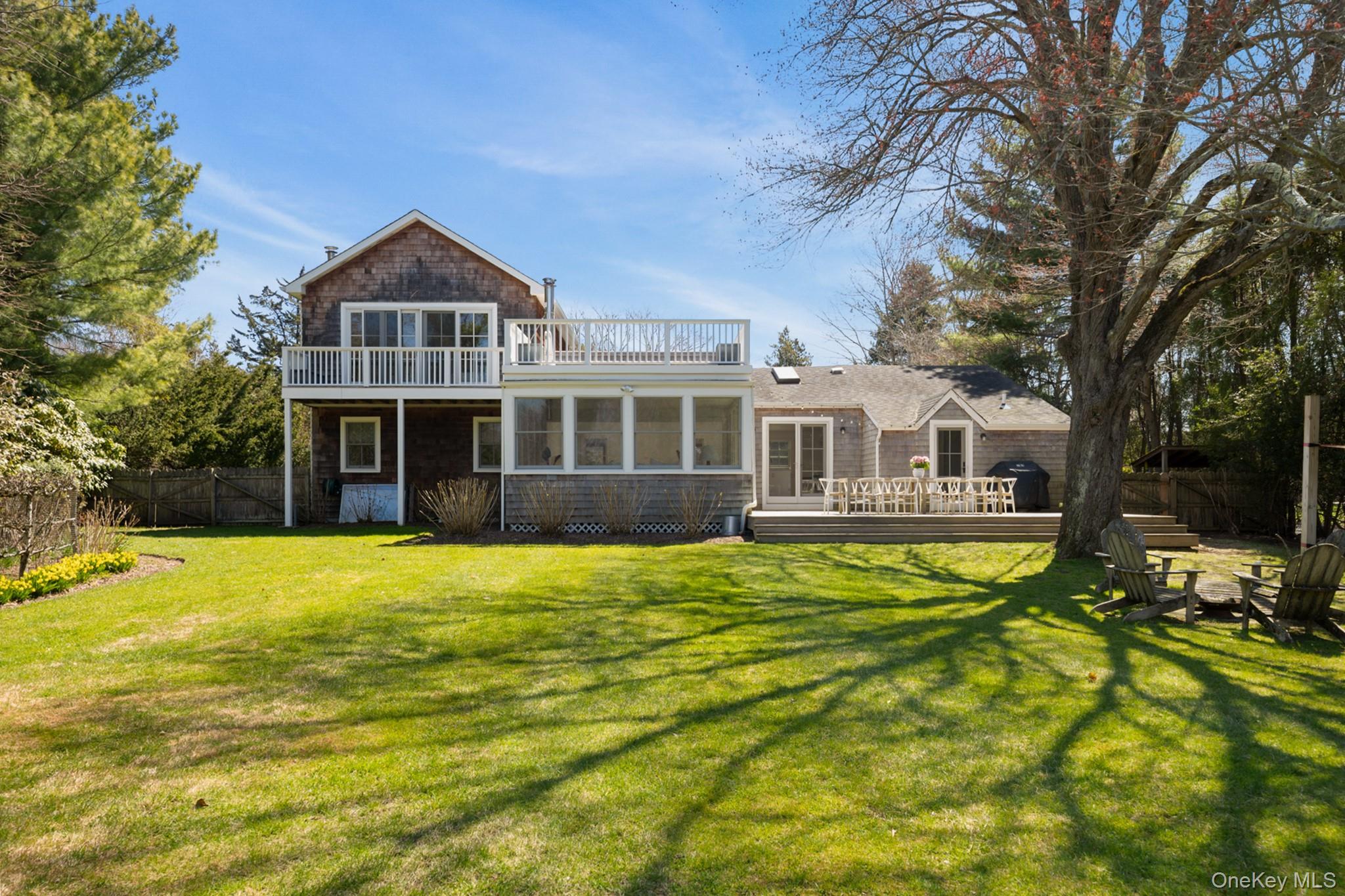 36 South Howells Point Road Bellport, NY 11713 - Photo 24 of 29 a front view of a house with a yard