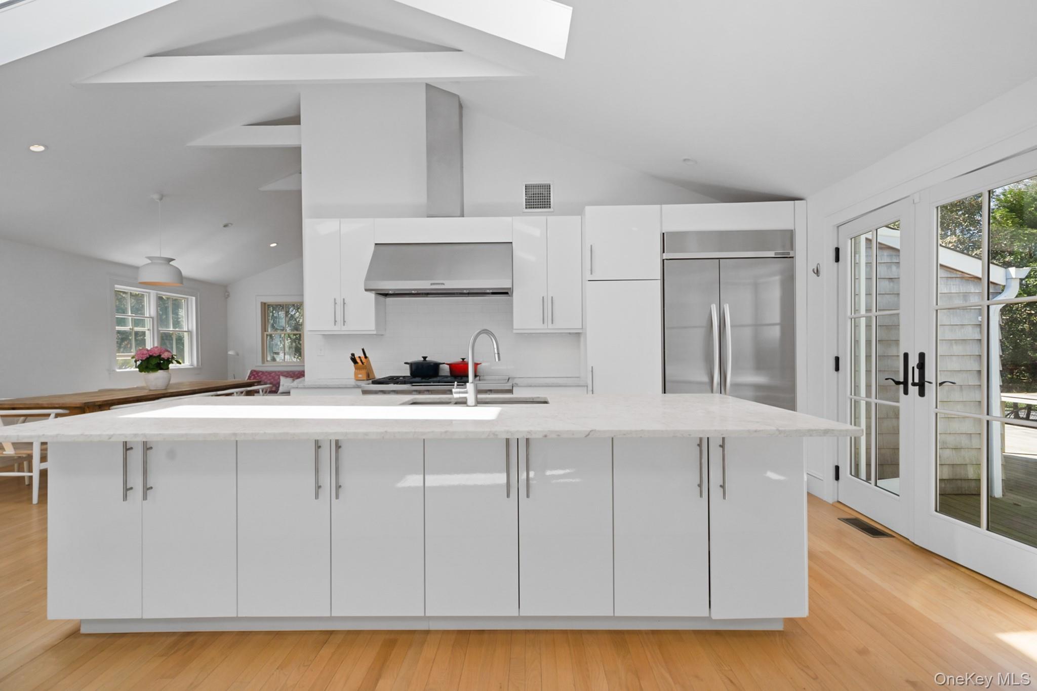 36 South Howells Point Road Bellport, NY 11713 - Photo 9 of 29 a kitchen with cabinets and a sink