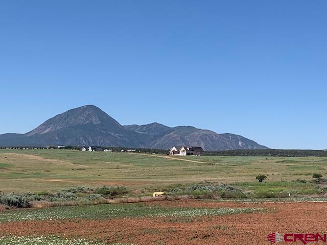 Lot 12 Road 17.9 Cortez Co 81321 Cortez, CO 81321 - Photo 21 of 21 a view of a lake with a mountain