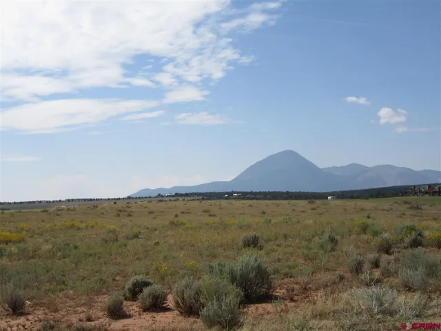 a view of an ocean and mountain