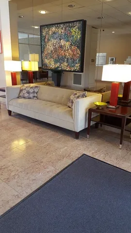a kitchen with granite countertop a cabinets and a stove top oven