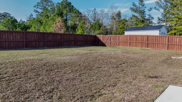 a view of backyard with green space