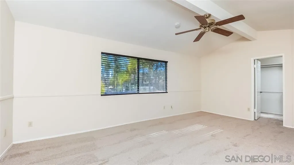 14662 Silverset Street Poway, CA 92064 - Photo 15 of 25 a view of a room with a ceiling fan and a window