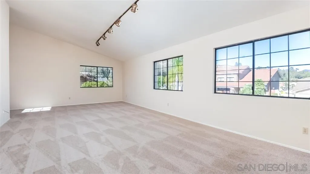 14662 Silverset Street Poway, CA 92064 - Photo 19 of 25 a view of an empty room with a window