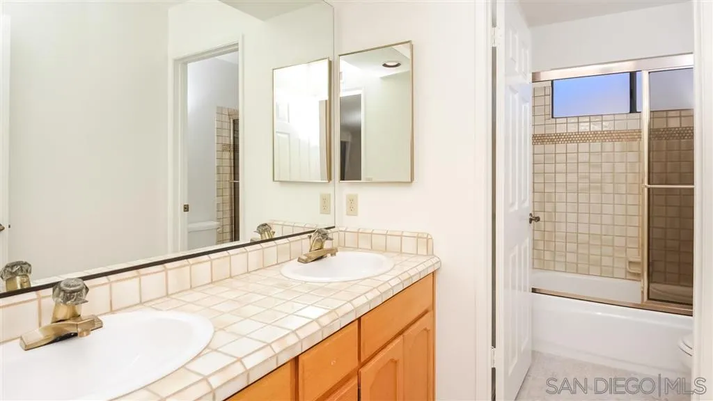 14662 Silverset Street Poway, CA 92064 - Photo 21 of 25 a bathroom with a sink and a mirror