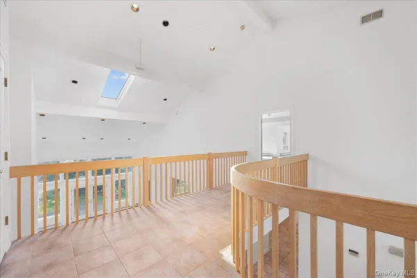 a view of a hallway with stairs