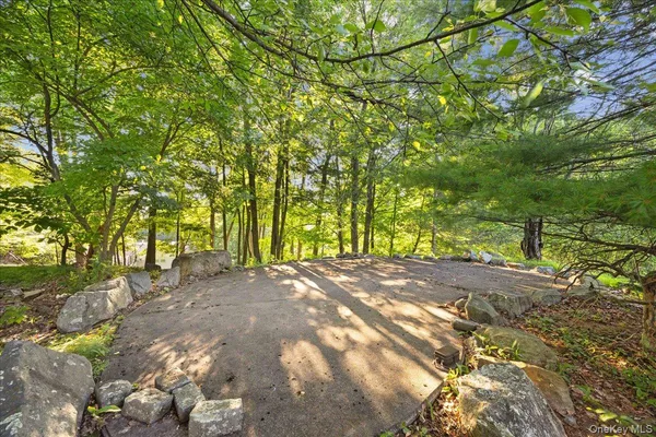 a view of a backyard with chairs and a table