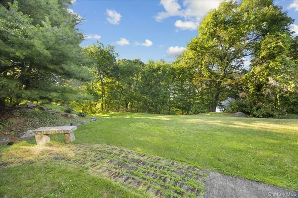 a front view of a house with a big yard