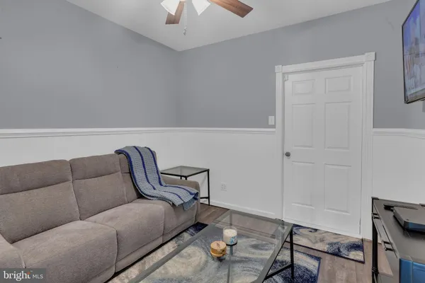 a living room with furniture and a rug