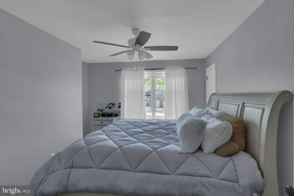 a bedroom with a bed and window