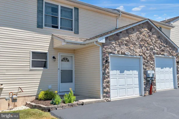 a view of a house with a garage