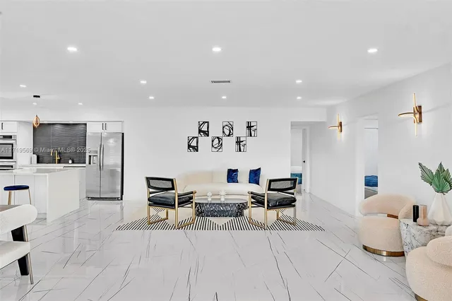 a living room with furniture and view of living room