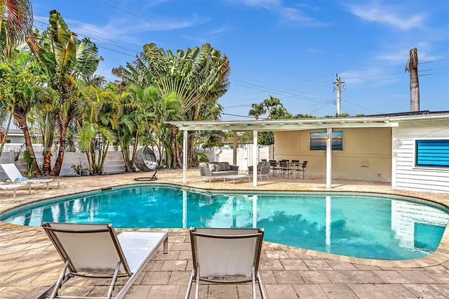 a view of a swimming pool with a patio