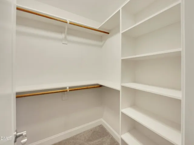 a view of an empty walk in closet