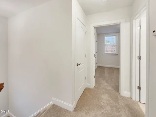 a view of a bathroom from the hallway