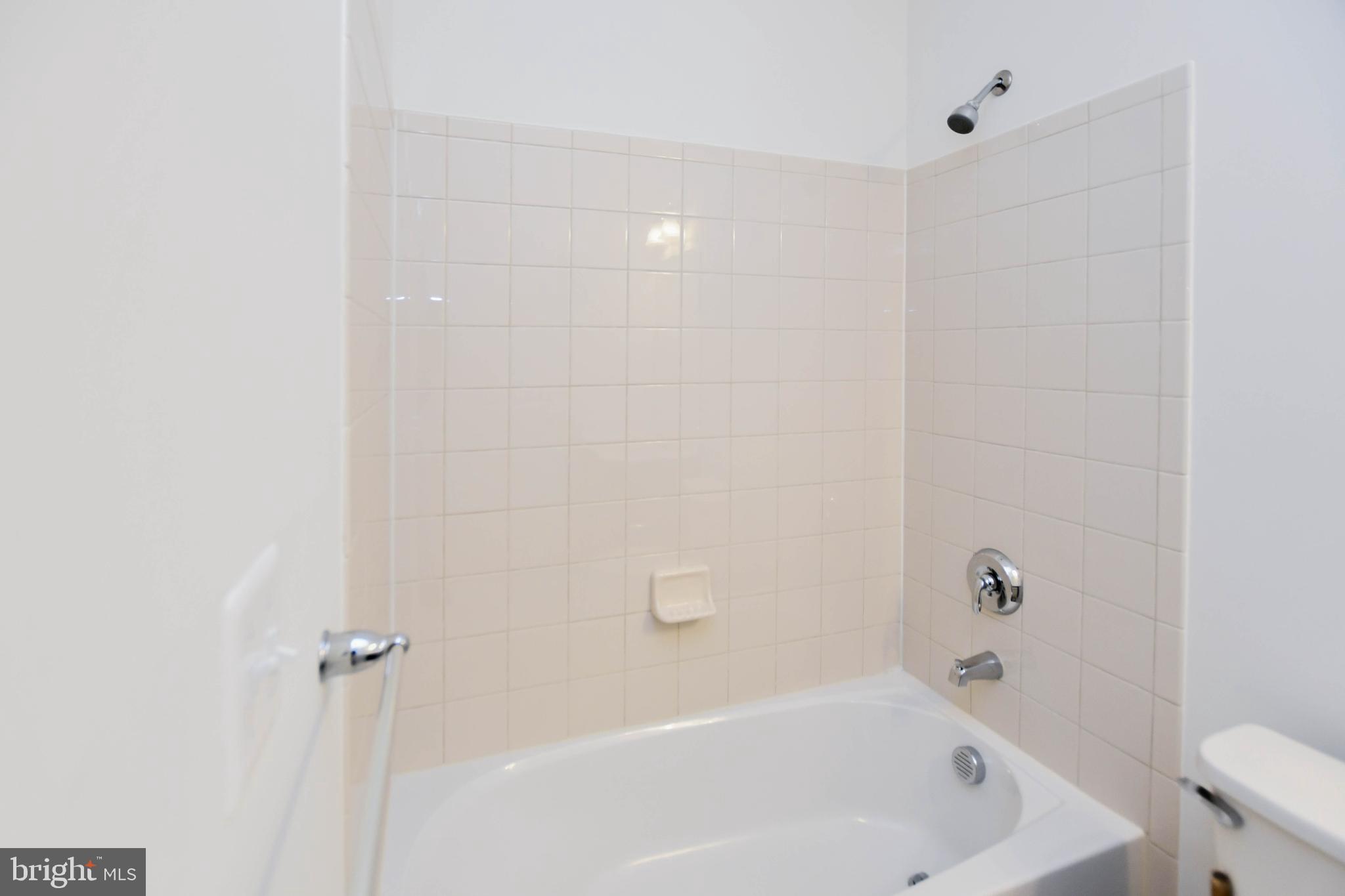 1610 Stream Valley Overlook Severn, MD 21144 - Photo 37 of 86 a bathroom with a bathtub