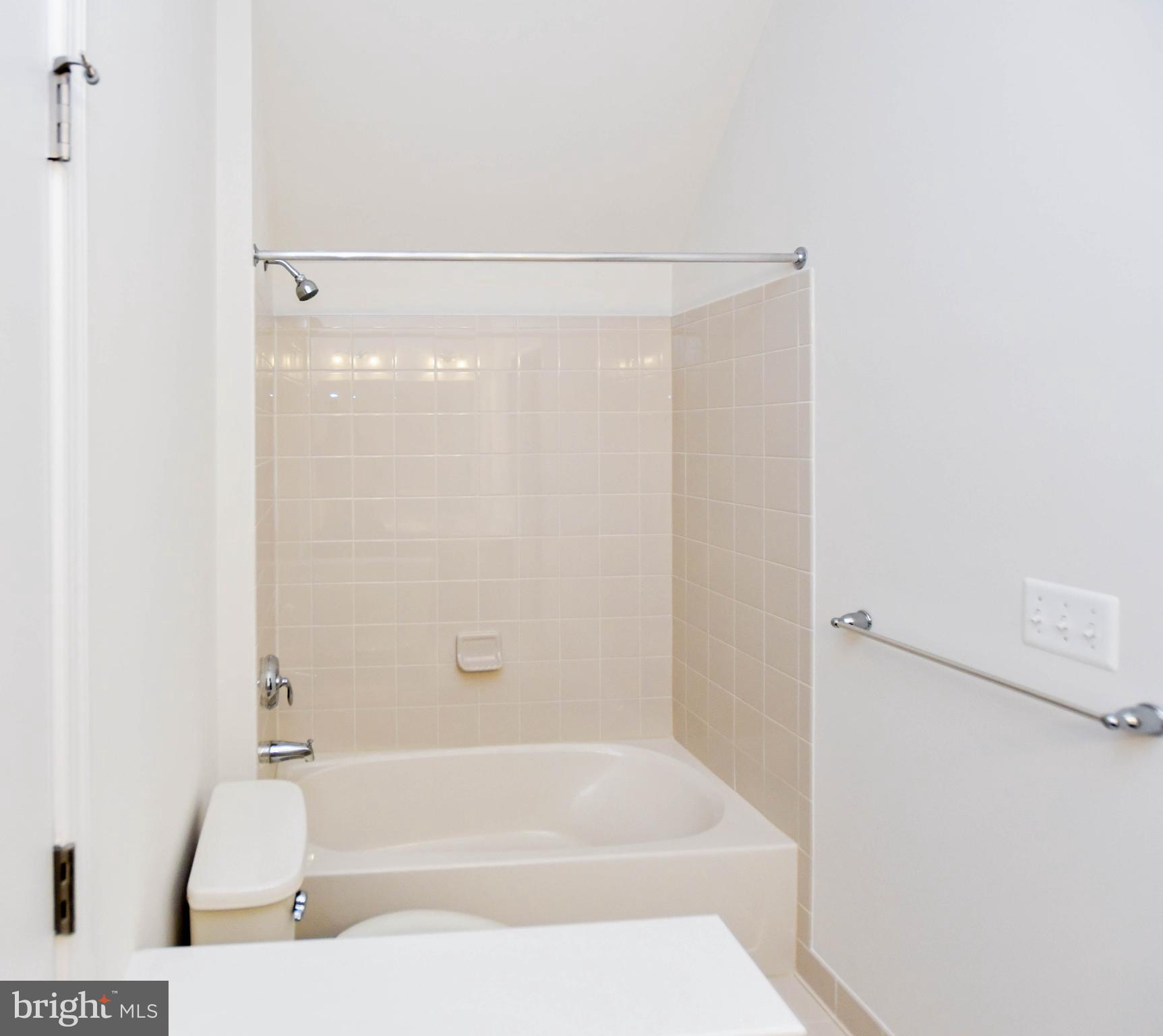 1610 Stream Valley Overlook Severn, MD 21144 - Photo 41 of 86 a bathroom with a bathtub and a shower
