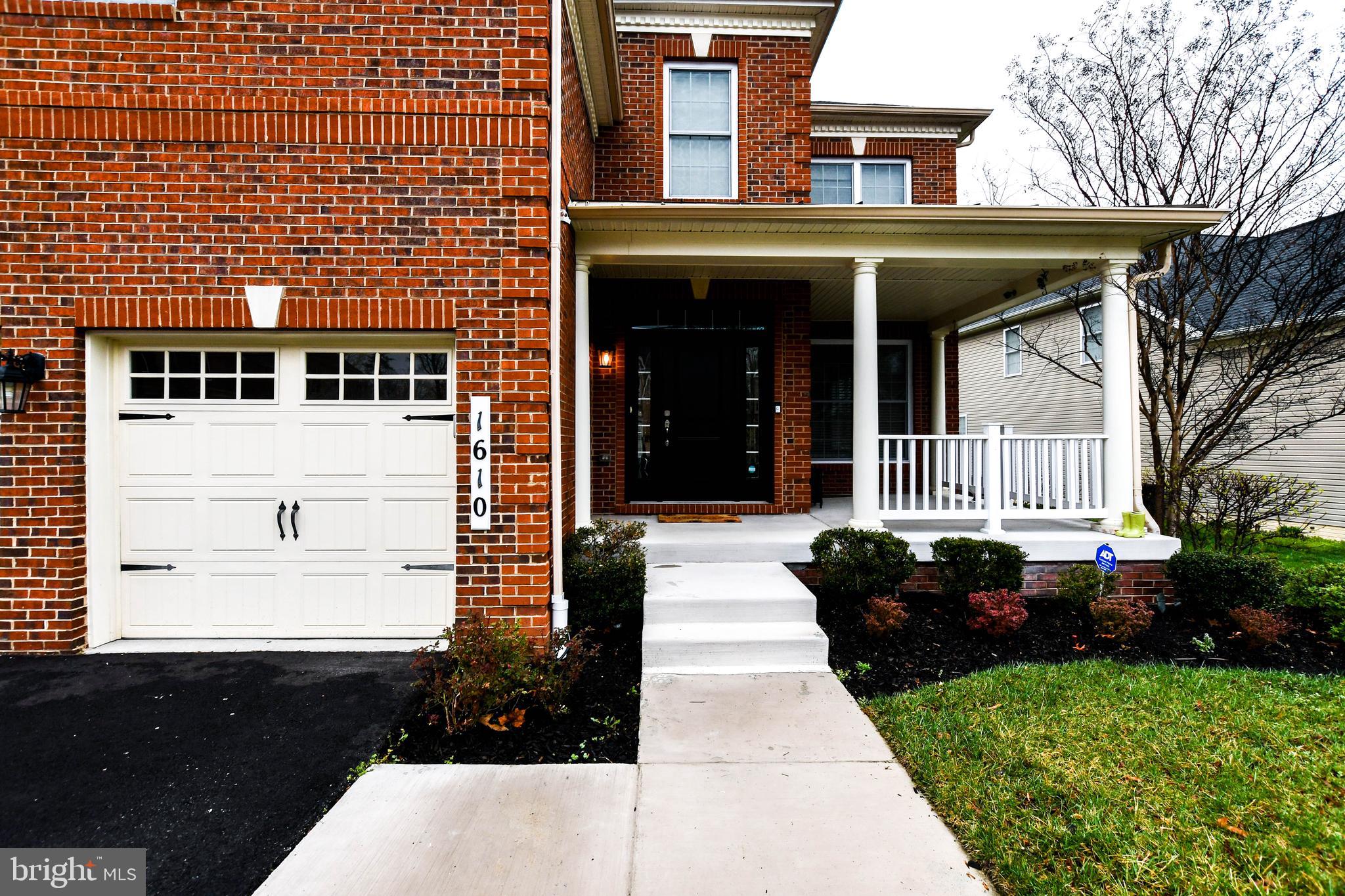 1610 Stream Valley Overlook Severn, MD 21144 - Photo 5 of 86 a front view of a house with garden