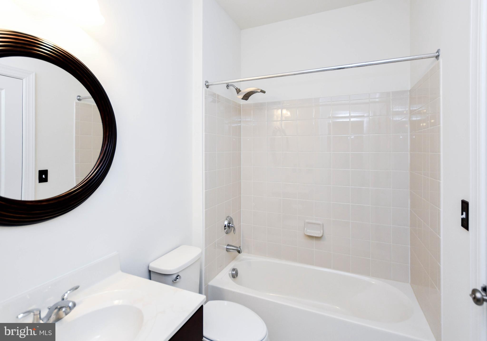 1610 Stream Valley Overlook Severn, MD 21144 - Photo 56 of 86 a bathroom with a bathtub and a sink