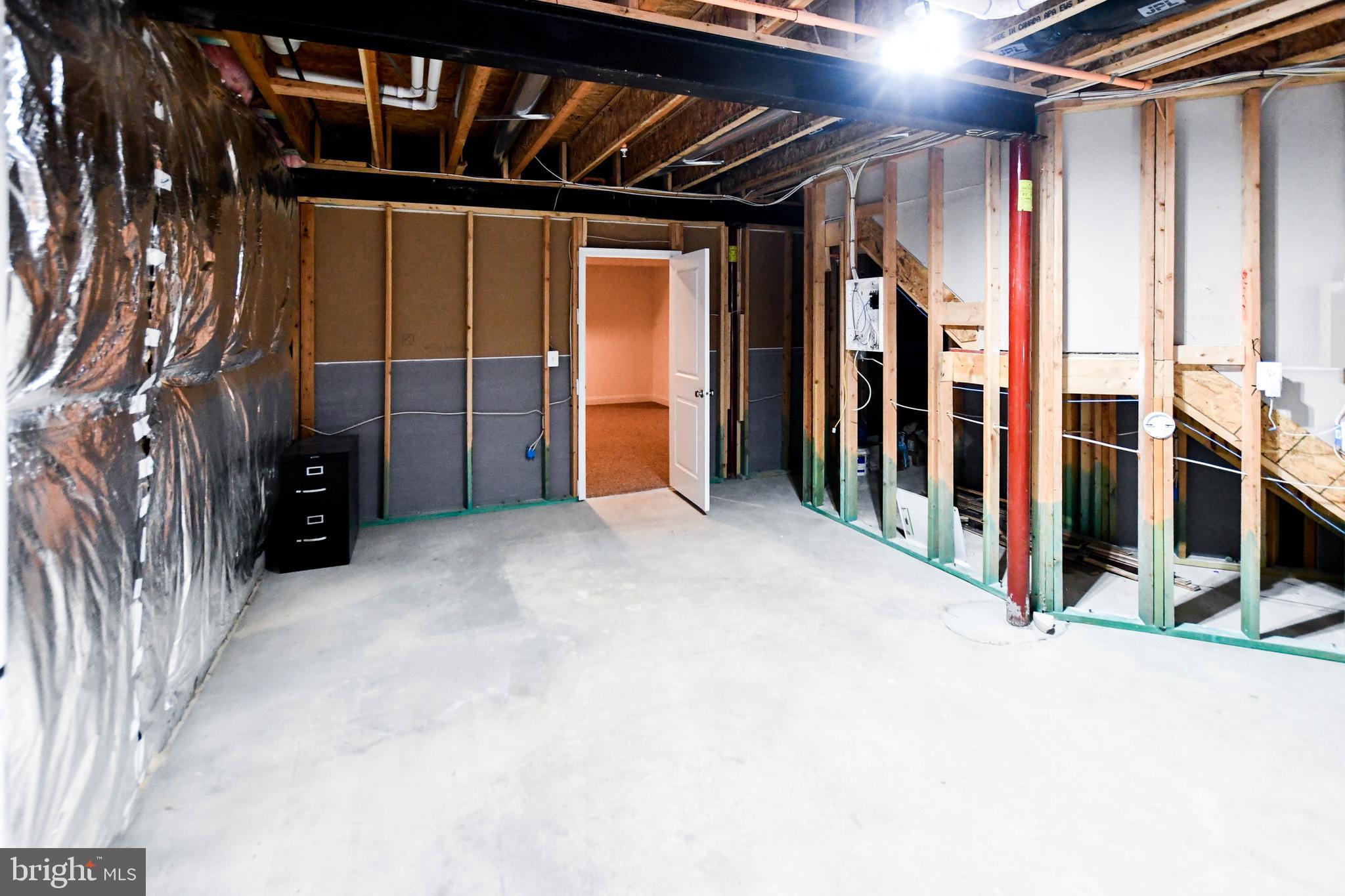 1610 Stream Valley Overlook Severn, MD 21144 - Photo 72 of 86 a view of an empty room with wooden floor