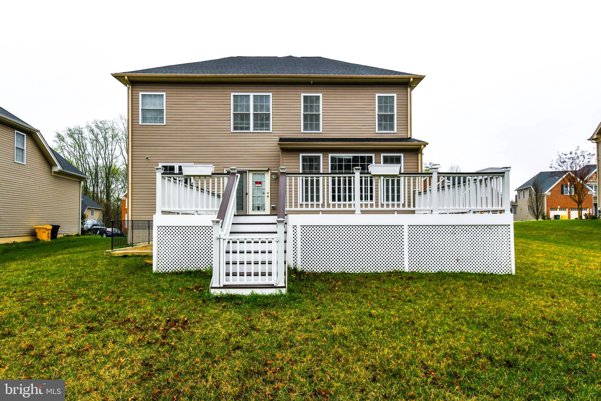 1610 Stream Valley Overlook Severn, MD 21144 - Photo 78 of 86 a front view of a house with a garden