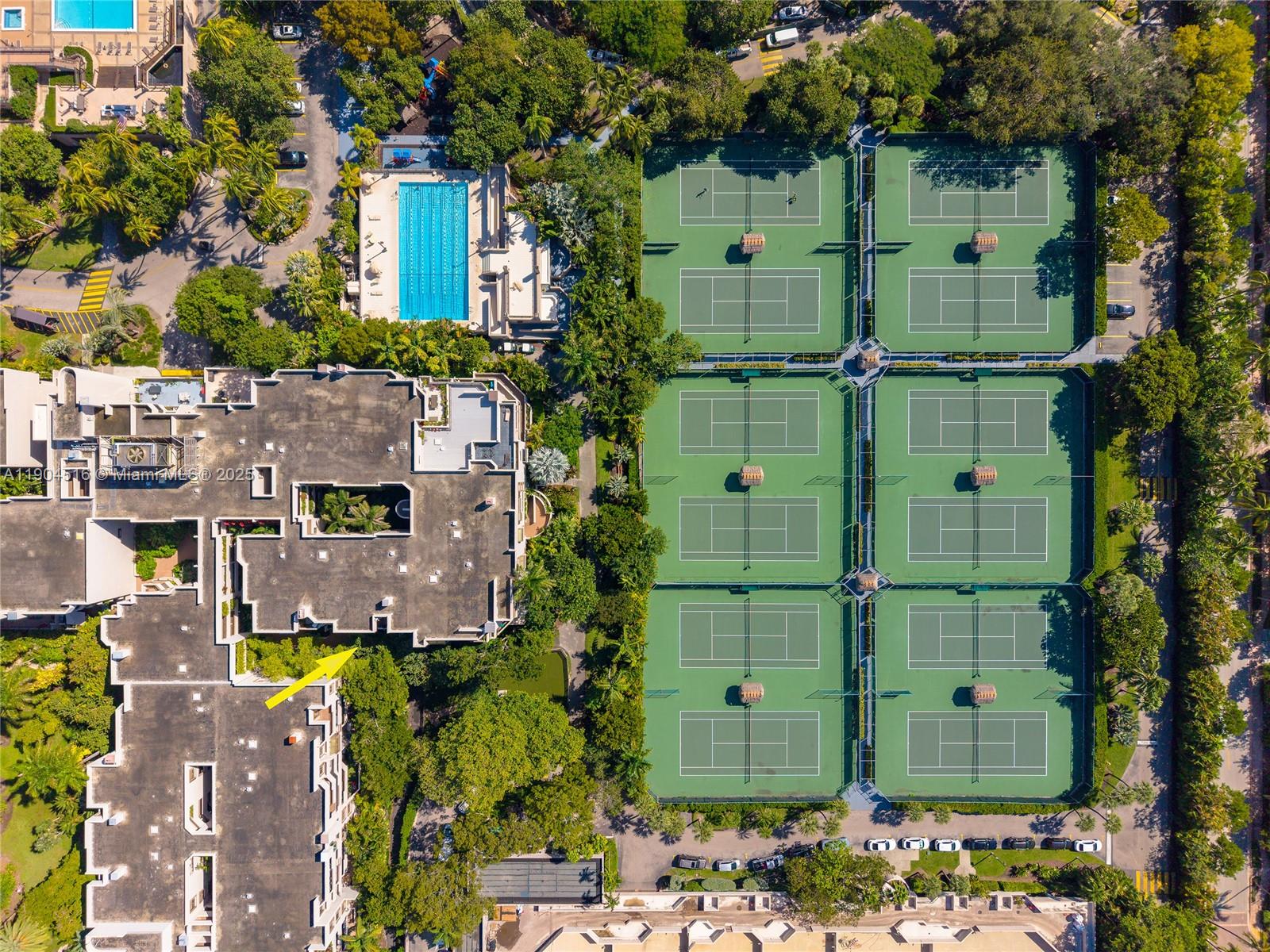 161 Crandon Boulevard, Unit 419 Key Biscayne, FL 33149 - Photo 19 of 35 an aerial view of a house with a swimming pool