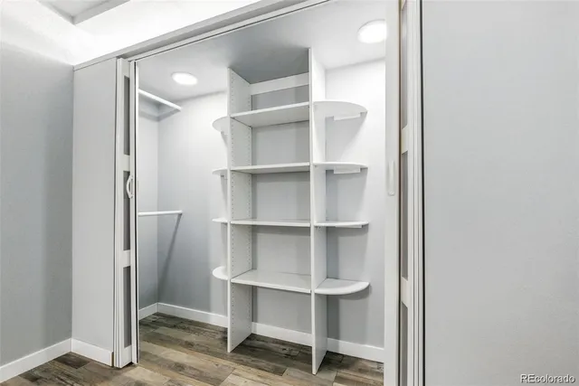 a view of an empty room with empty shelves