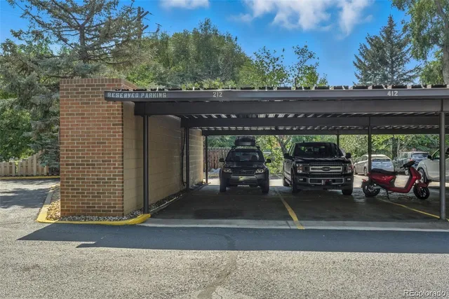a view of a porch with furniture and floor to ceiling window