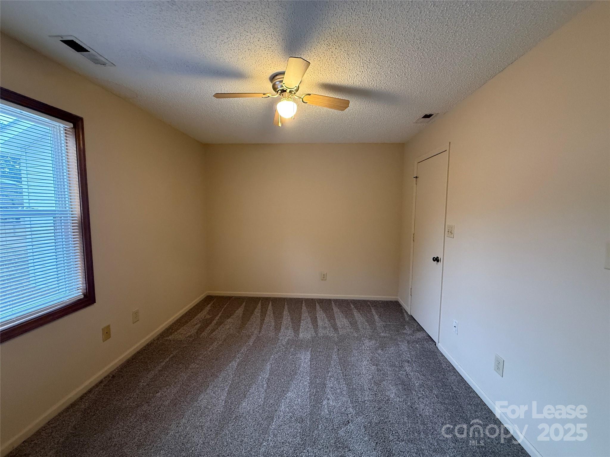 131 Pine Meadow Lane Mooresville, NC 28117 - Photo 12 of 20 a view of an empty room with a window