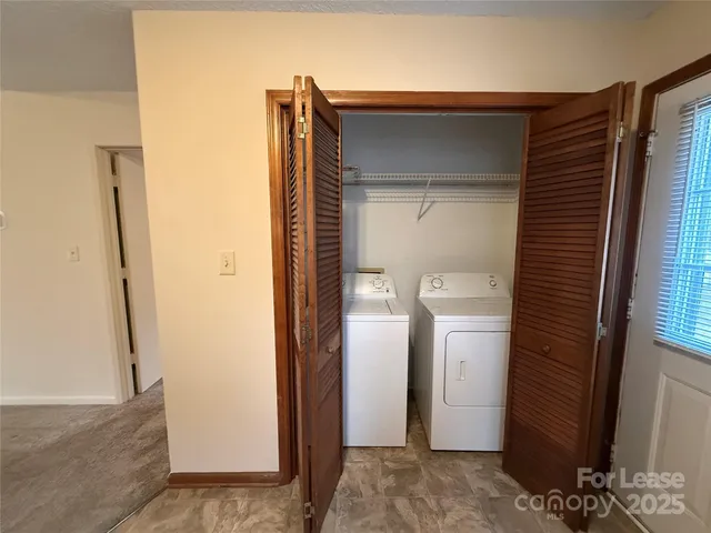 a view of hallway with wooden floor