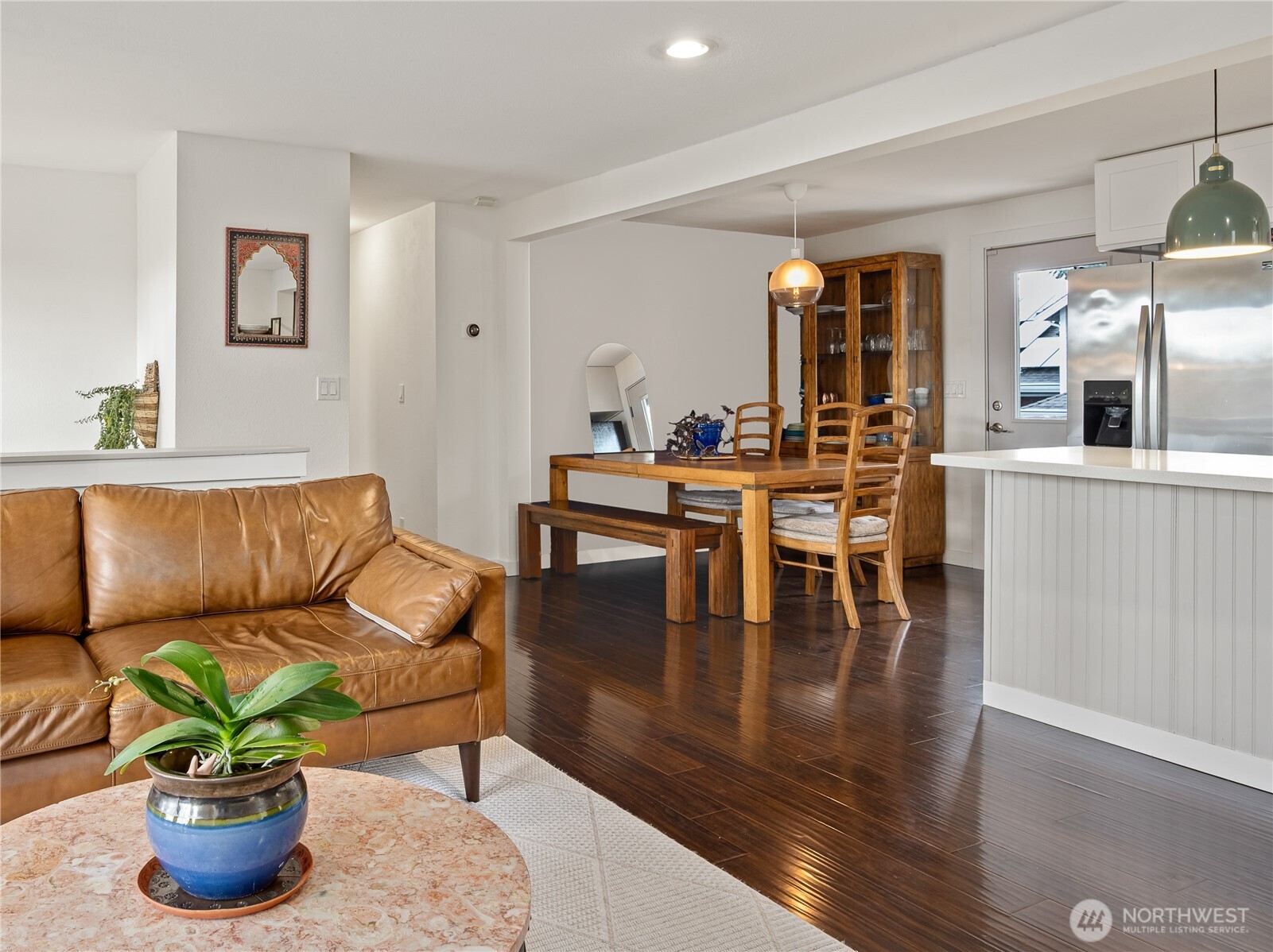 215 Hubbard Road Lynnwood, WA 98036 - Photo 11 of 30 a living room with furniture wooden floor and a potted plant