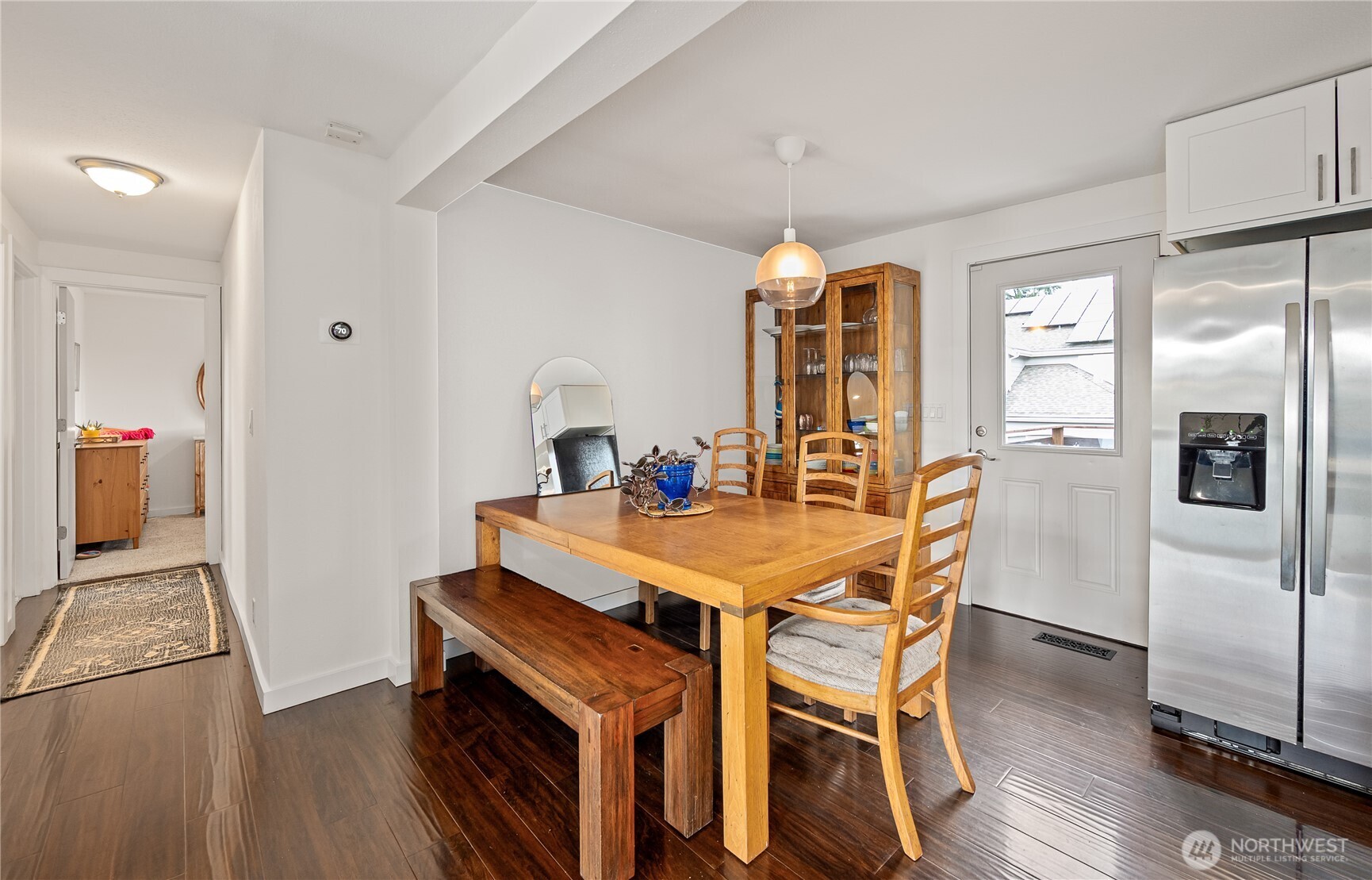 215 Hubbard Road Lynnwood, WA 98036 - Photo 12 of 30 a view of a dining room with furniture and wooden floor