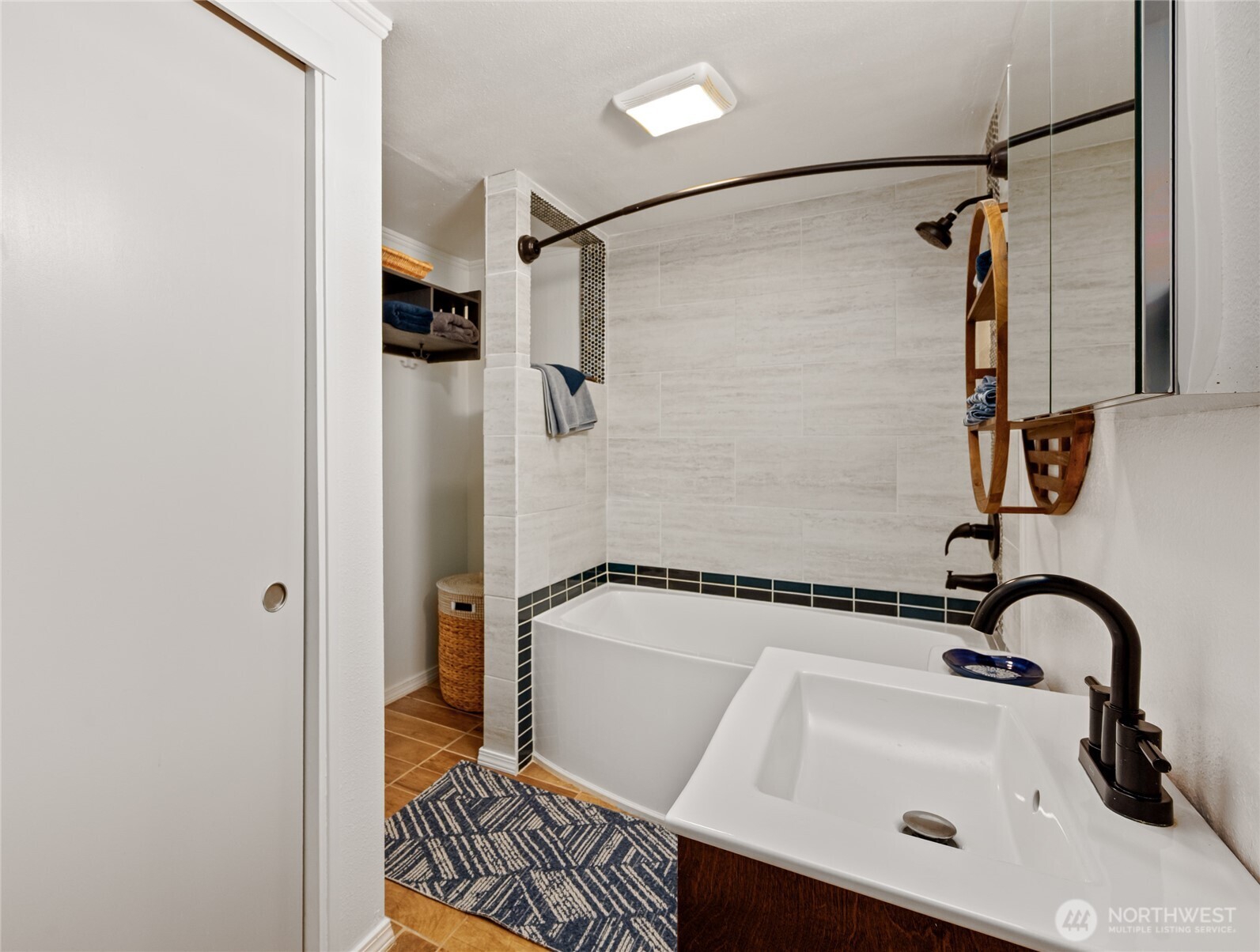 215 Hubbard Road Lynnwood, WA 98036 - Photo 25 of 30 a bathroom with a sink a glass door shower and mirror