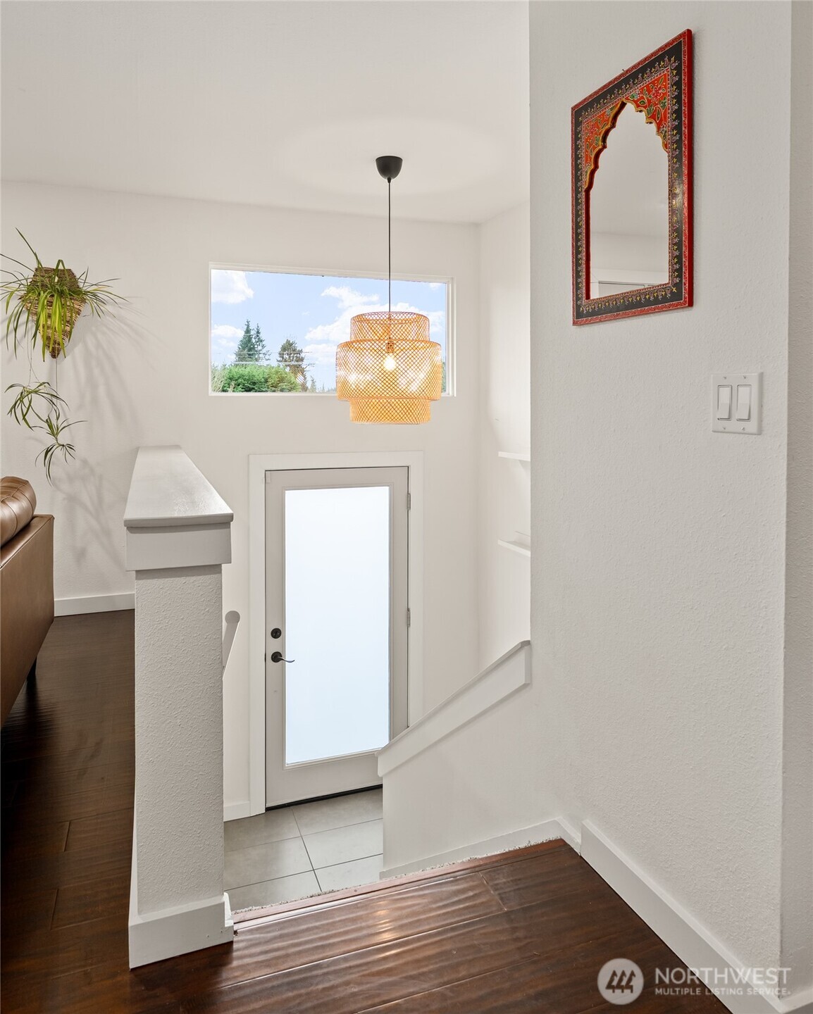 215 Hubbard Road Lynnwood, WA 98036 - Photo 3 of 30 a room with wooden floor and white walls