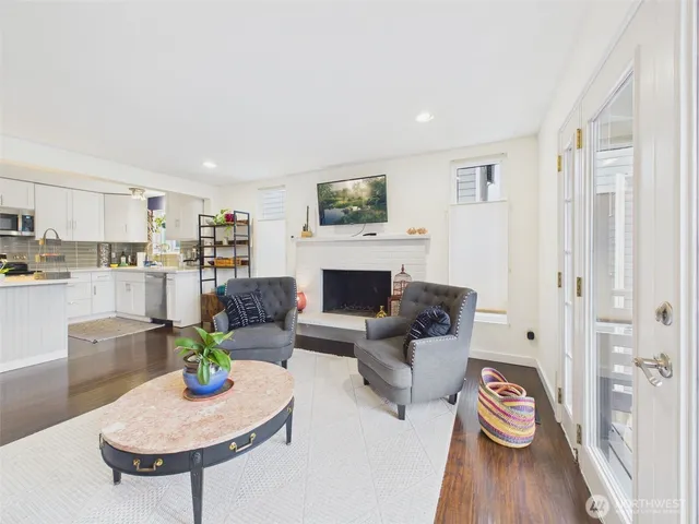 a kitchen with stainless steel appliances granite countertop a stove a sink dishwasher and a refrigerator