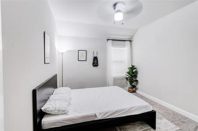 a kitchen with stainless steel appliances kitchen island granite countertop a stove a sink a dining table and chairs