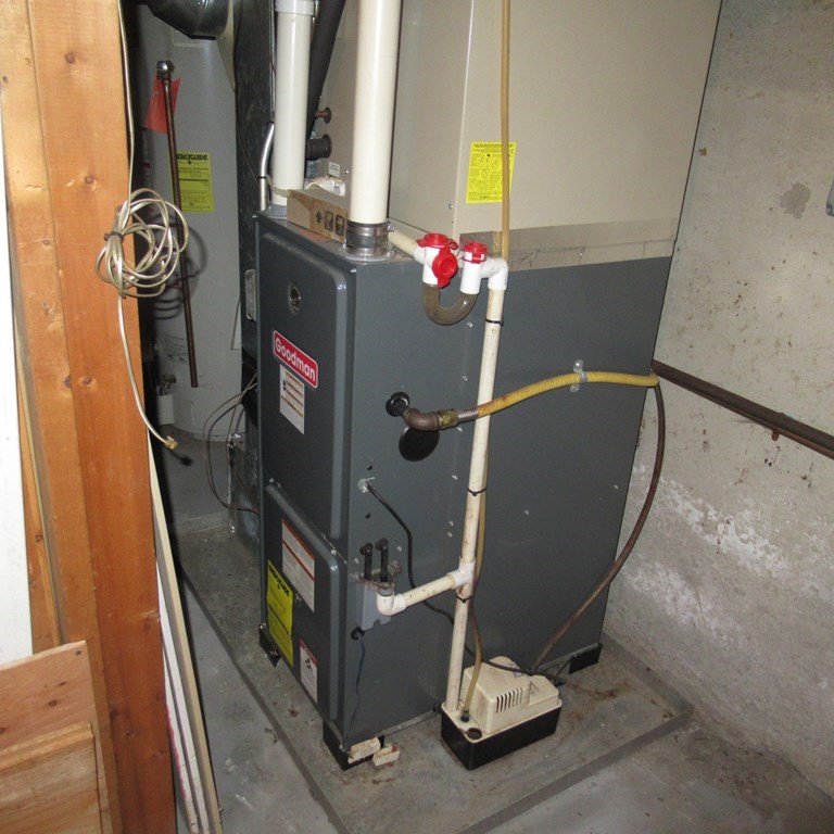 19 Haskell Road Pepperell, MA 01463 - Photo 25 of 40 a room with water heater and a window