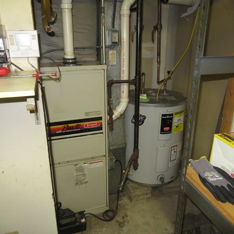 19 Haskell Road Pepperell, MA 01463 - Photo 27 of 40 a room with water heater and storage