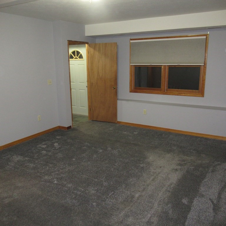 19 Haskell Road Pepperell, MA 01463 - Photo 31 of 40 a view of an empty room with a fireplace