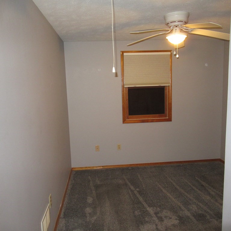 19 Haskell Road Pepperell, MA 01463 - Photo 35 of 40 a view of a small space with wooden floor and a ceiling fan