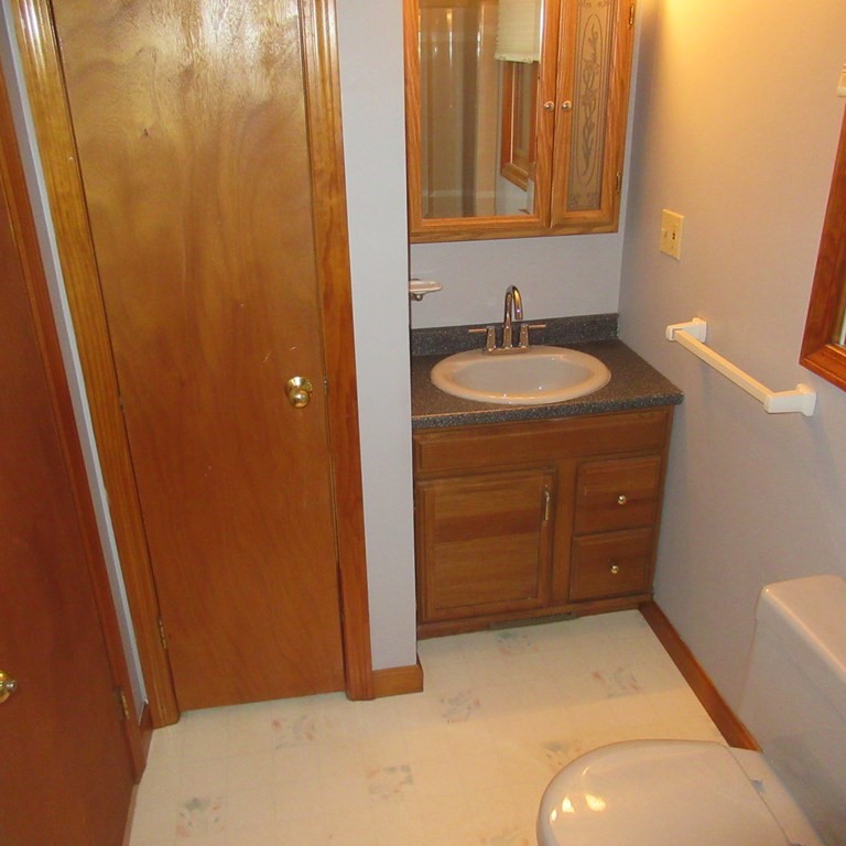 19 Haskell Road Pepperell, MA 01463 - Photo 38 of 40 a bathroom with a sink and a mirror