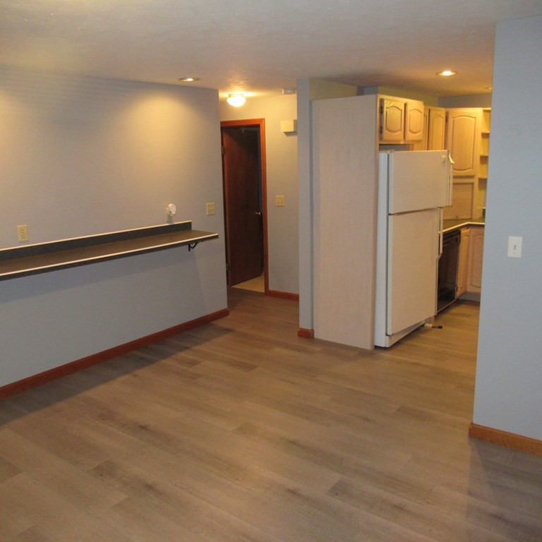 19 Haskell Road Pepperell, MA 01463 - Photo 39 of 40 a view of an empty room with a kitchen