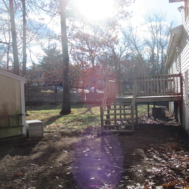 19 Haskell Road Pepperell, MA 01463 - Photo 8 of 40 a view of a yard with wooden fence
