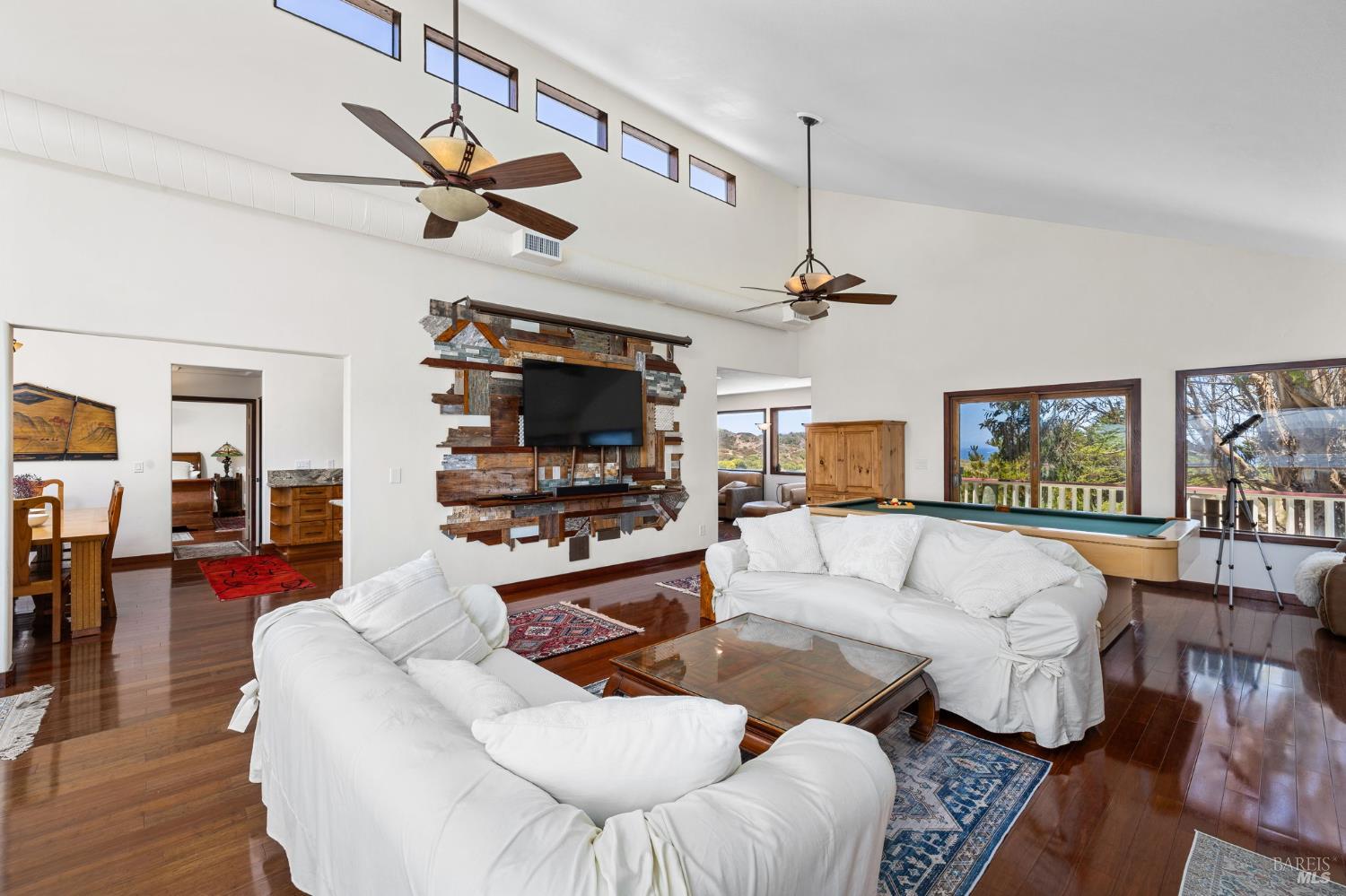 1846 Whaleship Road Bodega Bay, CA 94923 - Photo 29 of 69 a living room with furniture and a flat screen tv