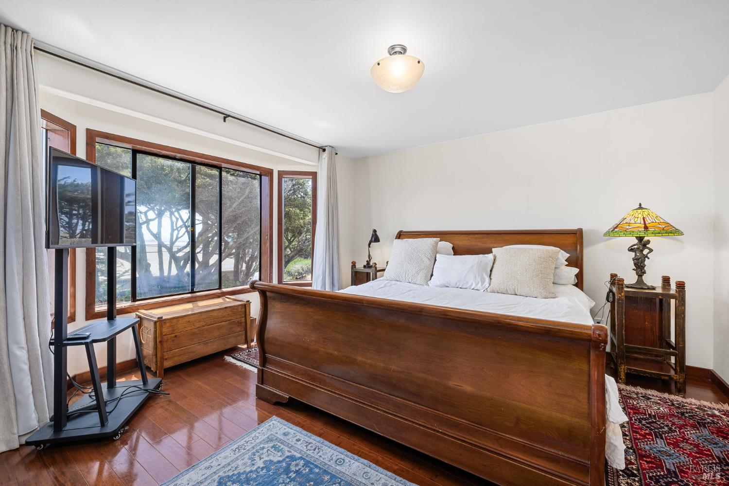 1846 Whaleship Road Bodega Bay, CA 94923 - Photo 35 of 69 a bedroom with a large bed and a window
