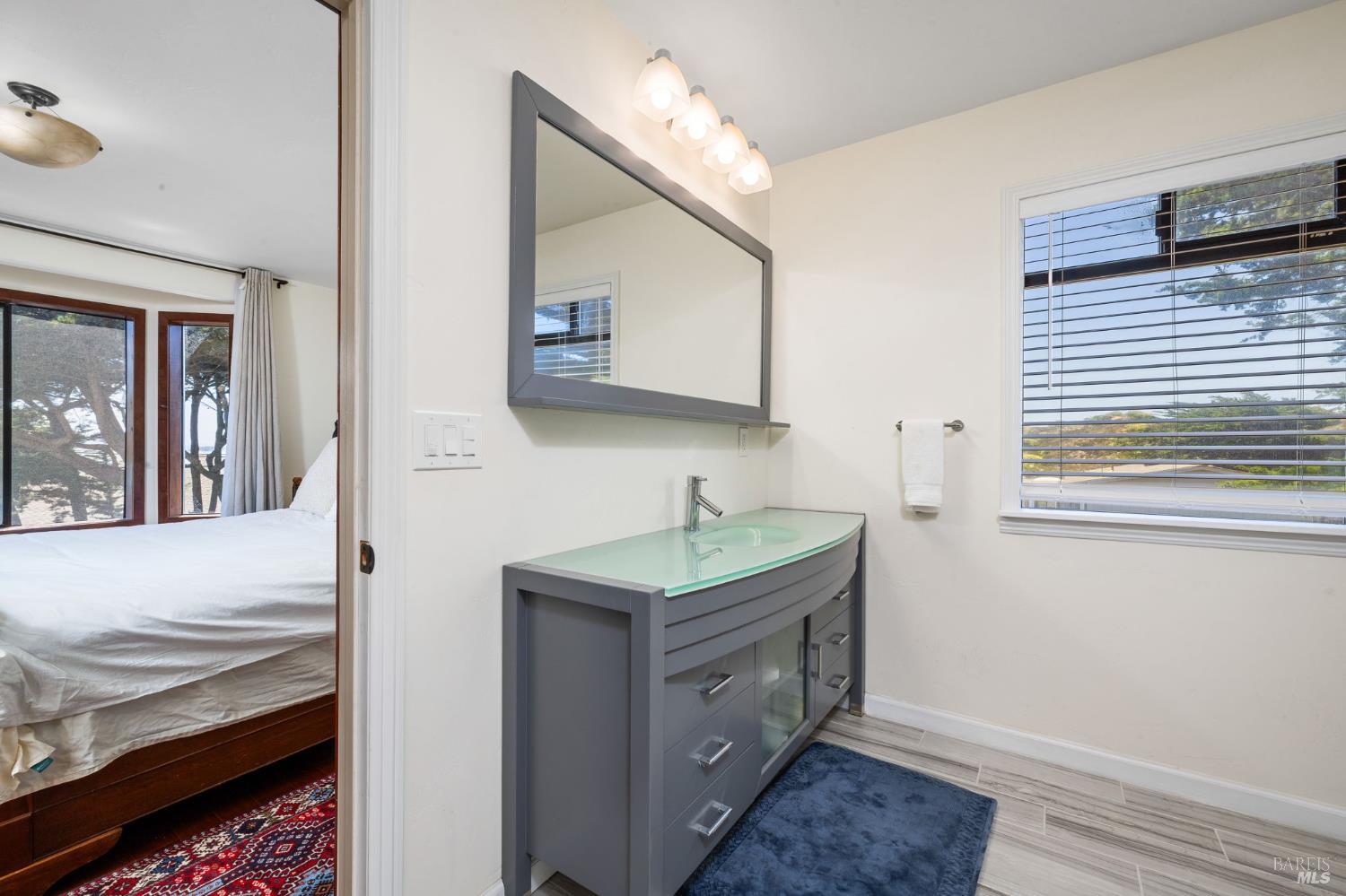 1846 Whaleship Road Bodega Bay, CA 94923 - Photo 38 of 69 a bathroom with a sink and a mirror