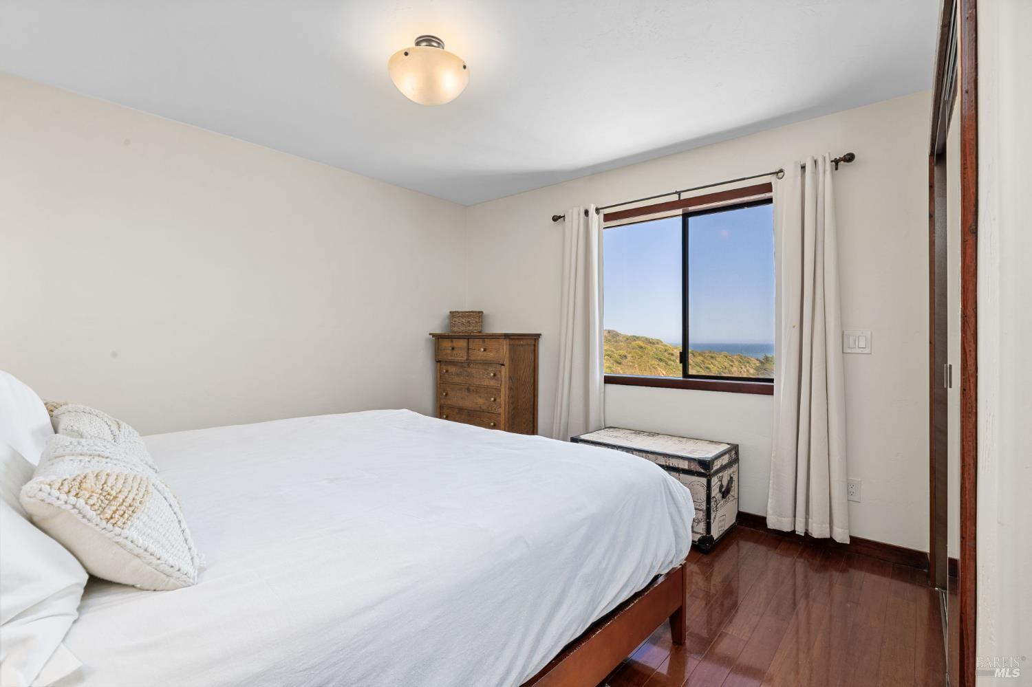 1846 Whaleship Road Bodega Bay, CA 94923 - Photo 42 of 69 a bedroom with a bed and a window